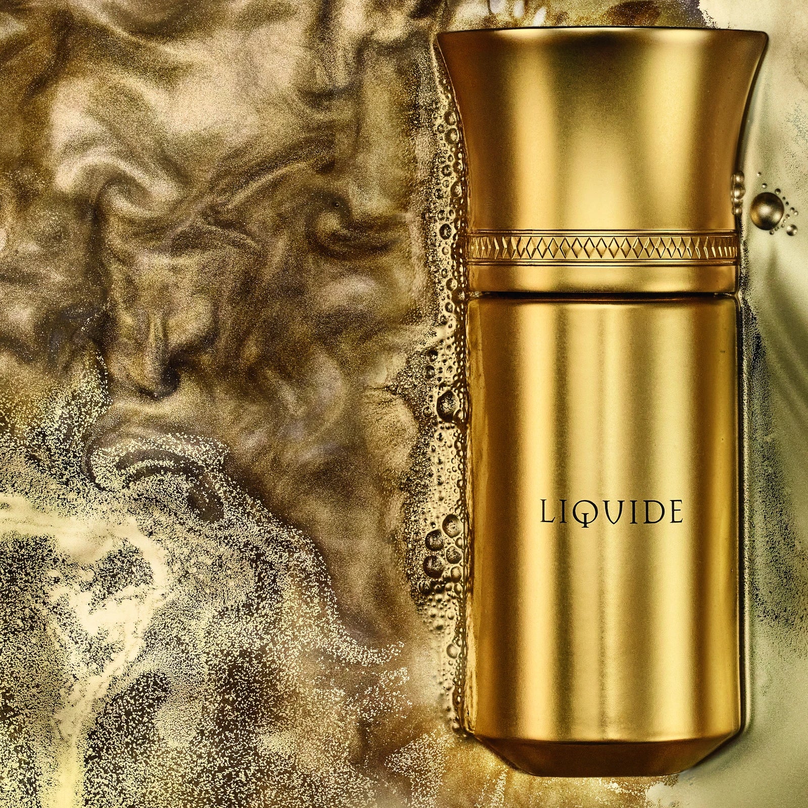 Liquides Imaginaires Liquide goldener Flakon auf flüssigem Gold