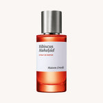 Hibiscus Mahajád Extrait de Parfum von Maison Crivelli, 100 ml Flakon vor hellem Hintergrund